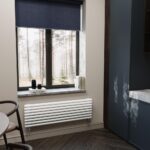 Стальной горизонтальный радиатор отопления Warmmet Round 42H ширина 1250 мм секций 7 цвет черный тип подключения: нижнее левое